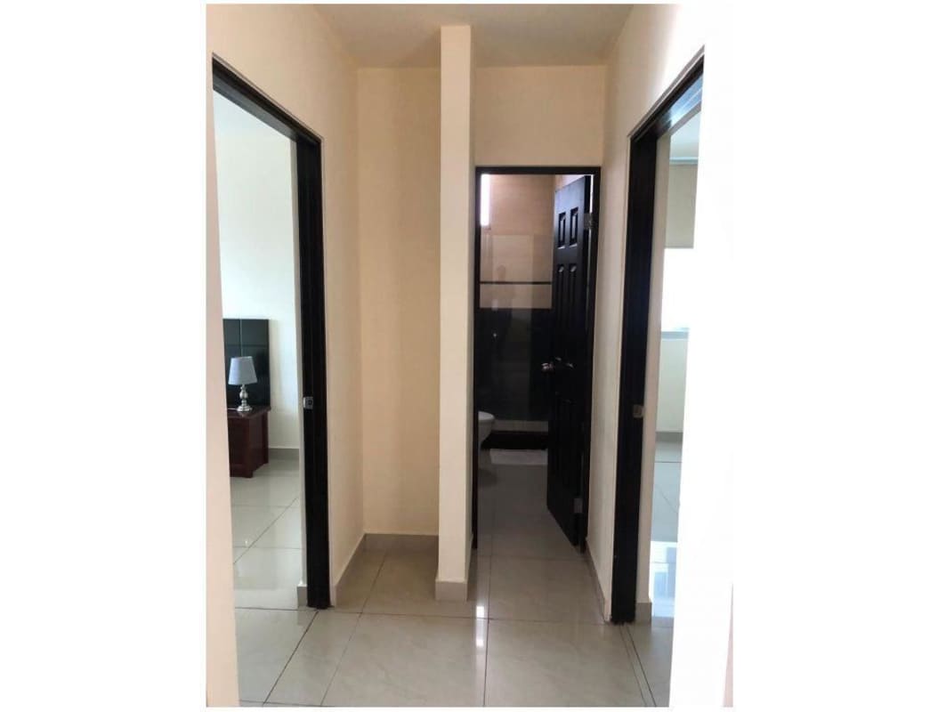 Interior hallway with access to bedrooms and bathroom at PH Pacific Sky Punta Paitilla Panama City