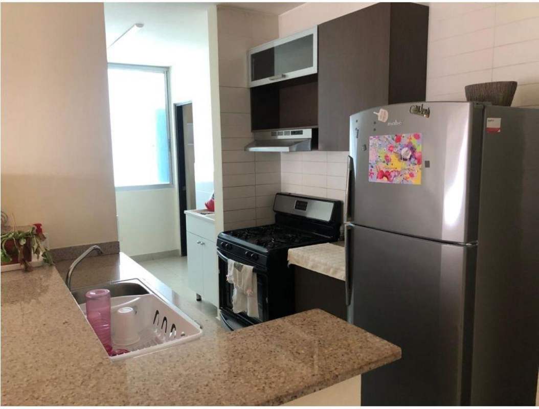 Modern kitchen with granite countertops, gas stove, stainless steel appliances in PH Pacific Sky Punta Paitilla Panama