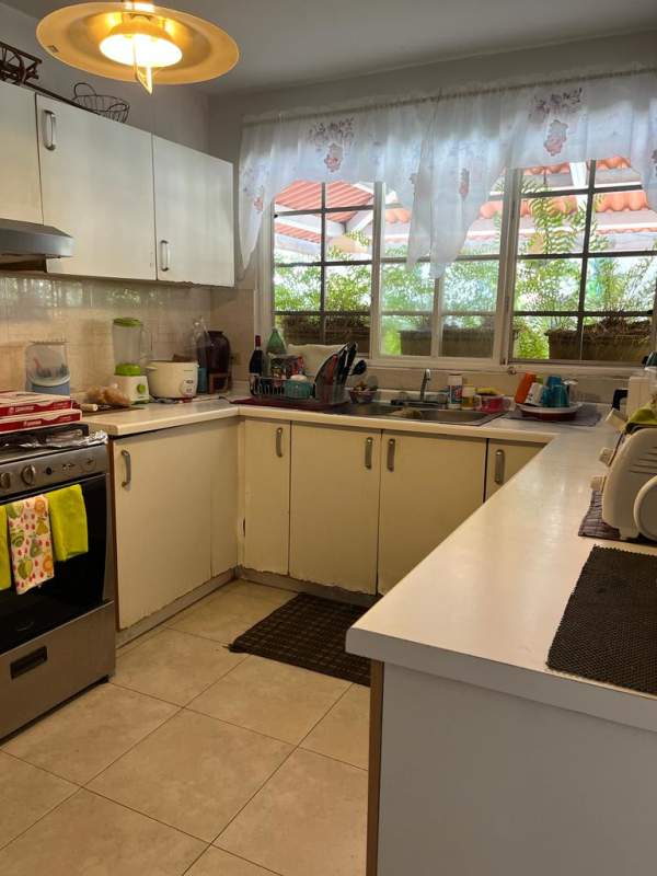 Open concept living and dining room with tiled floors in Brisas del Golf Panama