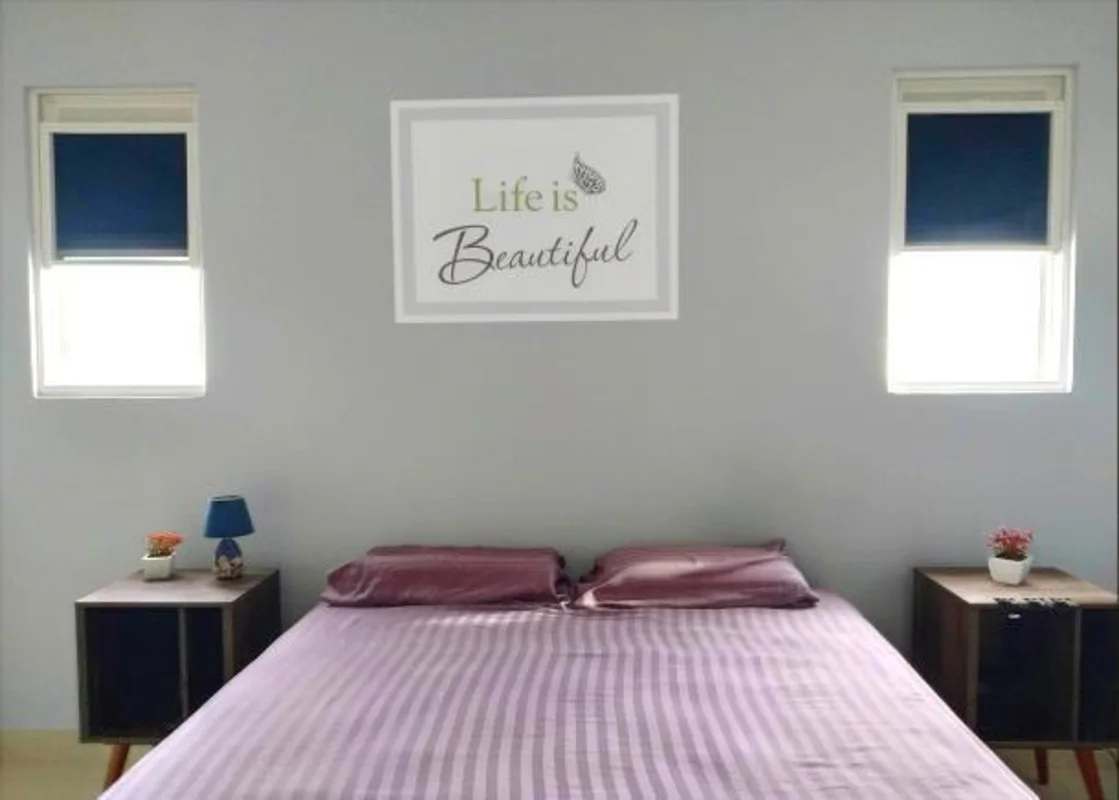 Master bedroom with framed art, tile floor, blinds in PH Augusta Brisas del Golf