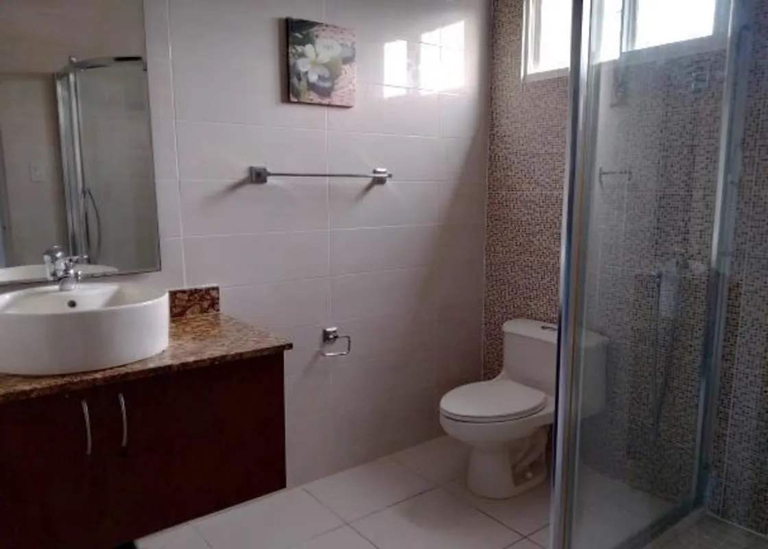 Kitchen with black cabinetry and gas stove PH Augusta Brisas del Golf Panama