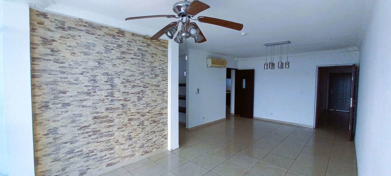 Second bedroom with large window, AC unit, ceiling fan and closet Villa de Las Fuentes Panama City