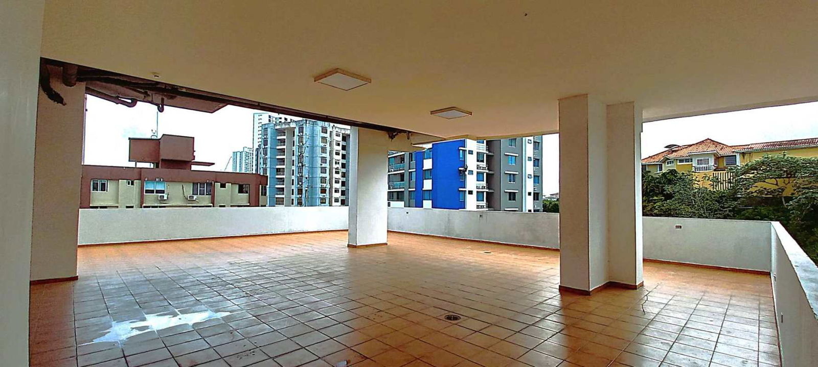 Panoramic balcony view overlooking city skyline and greenery Villa de Las Fuentes Panama