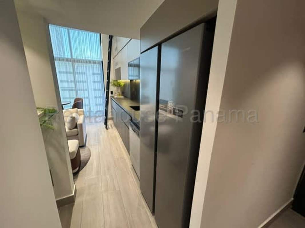 Modern loft with floor-to-ceiling windows and stylish staircase PH Dovle Coco del Mar