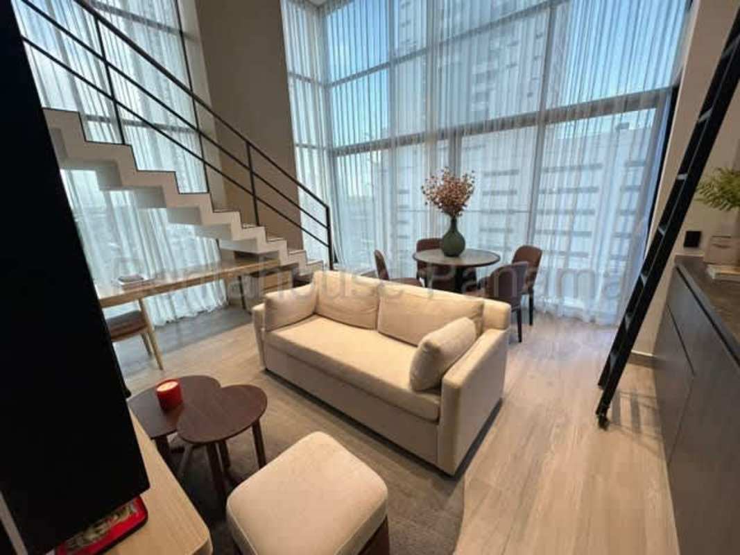 Bedroom featuring large windows, ocean skyline views and natural light in PH Dovle Coco del Mar