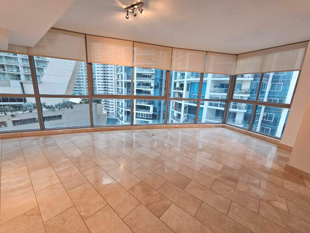 Large balcony enclosed with glass panoramic ocean views at Grand Tower Panama City