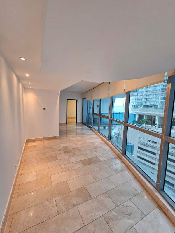 Spacious living room with floor-to-ceiling windows panoramic city skyline Grand Tower