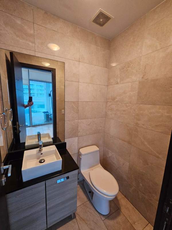 Elegant half bathroom with vessel sink at PH Grand Tower Punta Pacifica Panama
