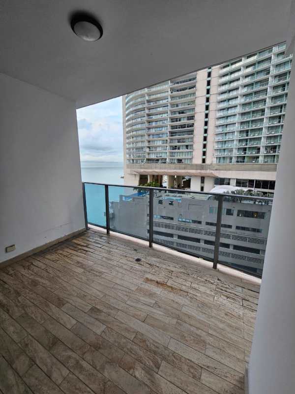 Panoramic balcony view of ocean and city high-rise apartment Grand Tower Panama