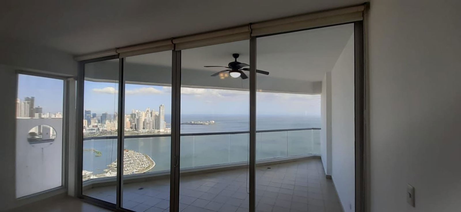 Bright open plan living room with ocean views at PH Rivage Tower Panama