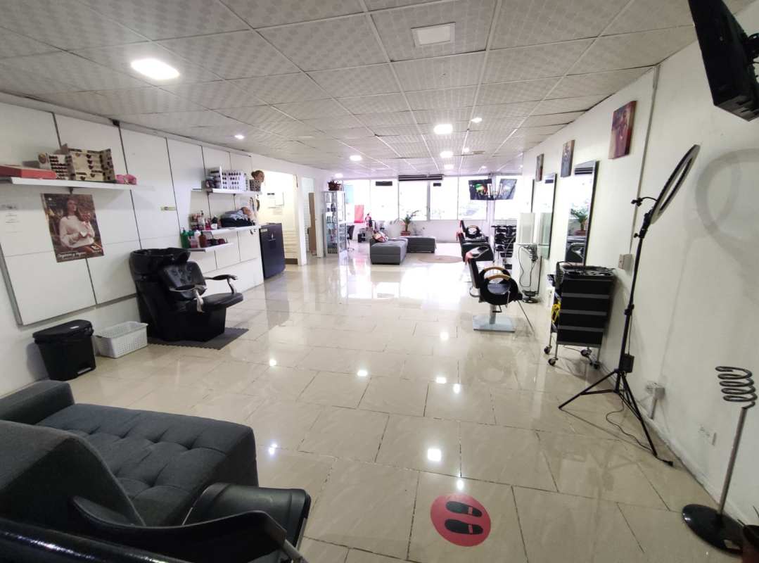 Salon waiting lounge area with product displays and stylish decor in beauty business for sale Panama