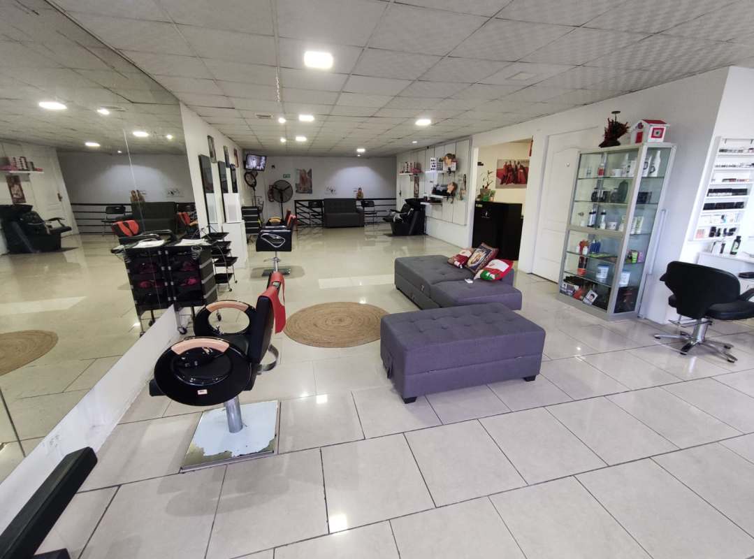 Manicure and pedicure stations with bright decor inside Condado del Rey beauty salon Panama