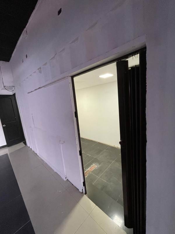 Industrial covered walkway with yellow beams and parking view Midpoint Plaza Coco del Mar Panama