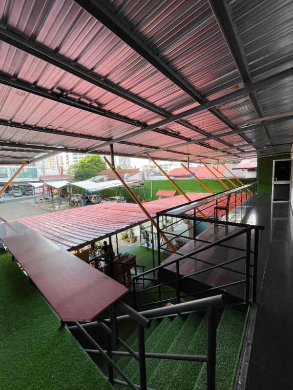 Commercial open space with unfinished white walls tiled floor Midpoint Plaza Panama City