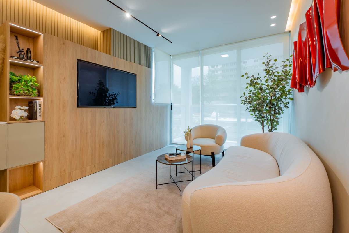 Contemporary kitchen area with marble countertops and wood cabinetry in Condado Gardens