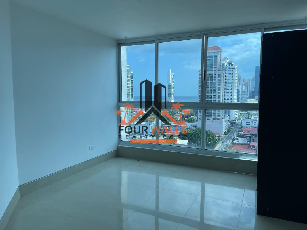 Kitchen with granite countertops, wooden cabinets, tile backsplash in PH Colosal San Francisco Panama