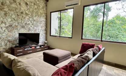 Open colonial kitchen with granite countertops, wooden cabinets, appliances Penonomé Coclé Panama