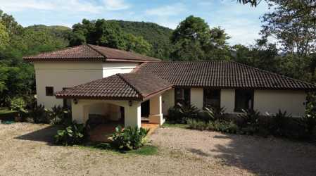 Shaded colonial terrace with stone pillars and lush views in Penonomé country house Coclé Panama