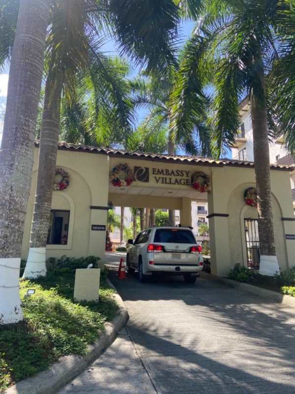 Modern kitchen with granite countertops, wood cabinets, spacious design in Embassy Village Clayton Panama City