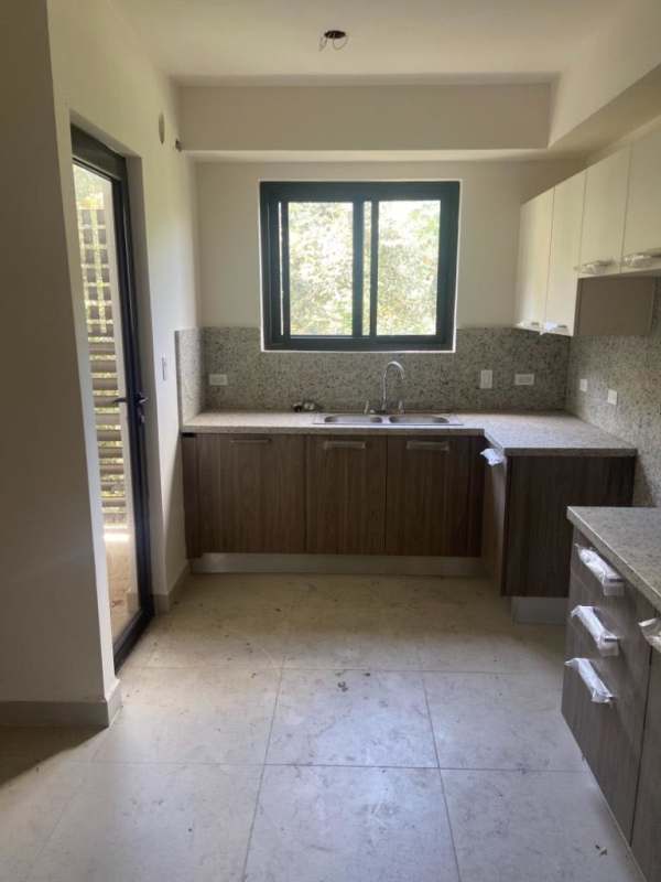 Bright modern kitchen granite countertops natural light Embassy Village Clayton Panama