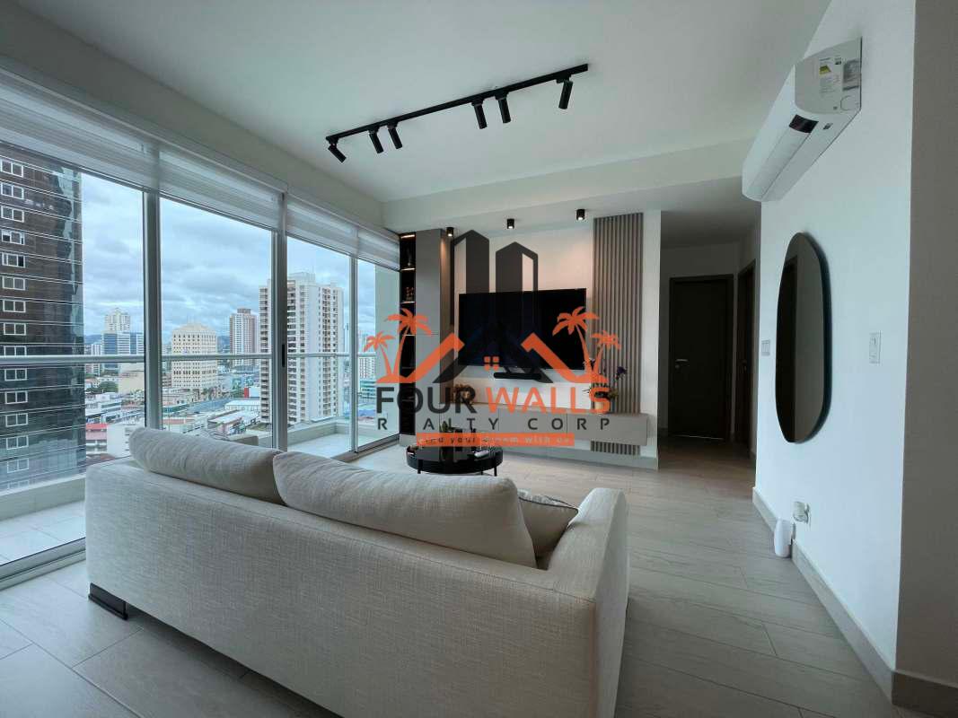 Spacious living dining room with floor-to-ceiling windows and city skyline in PH Urbana Obarrio Panama
