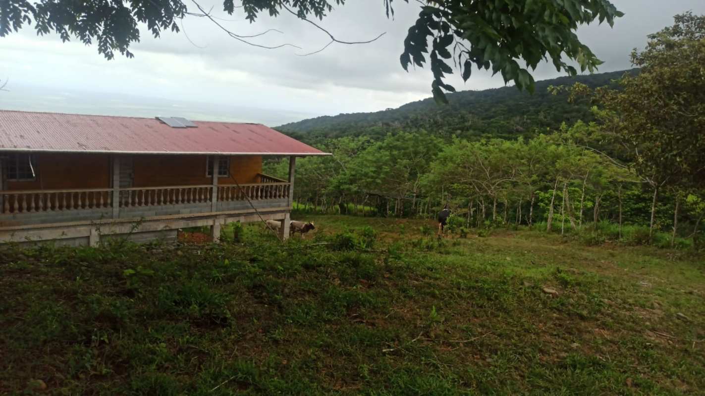 Farmhouse with balcony porch and solar panel overlooking Panama countryside for sale