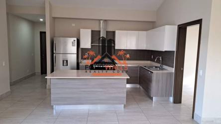 Spacious kitchen dining with island, modern cabinetry in Panama Pacifico condo for sale