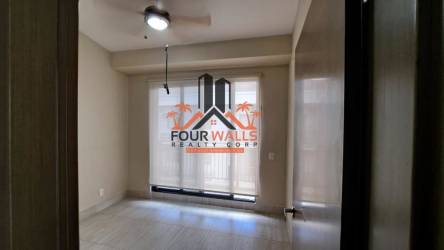 Bedroom with split AC, roller blinds, tile floors at PH River Village for sale