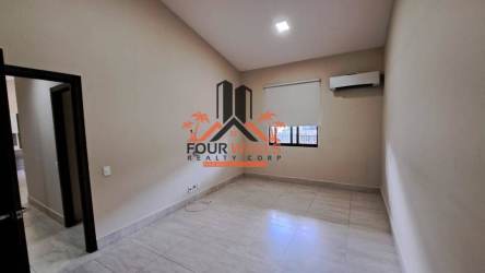 Empty bedroom with tile floors, window, roller blinds, split AC in Panama condo