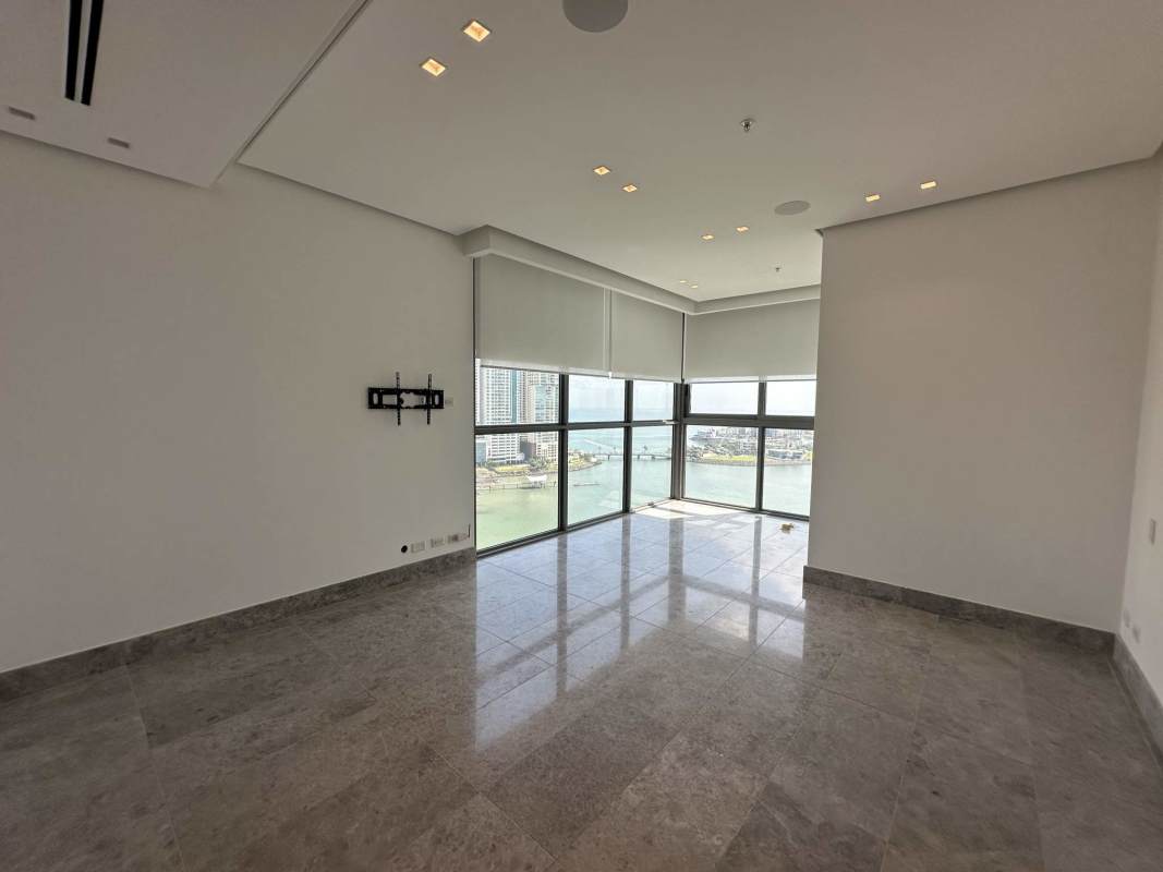 Spacious master bedroom with large windows and ocean city view at Sea Point Paitilla Panama