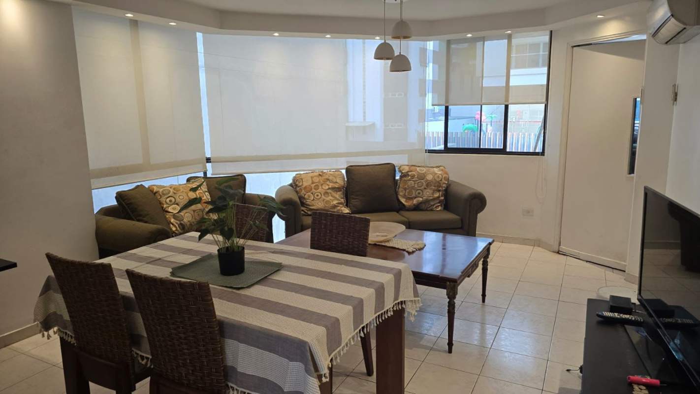 Living and dining room with windows, tiled floor, air conditioning in apartment at PH Viscaya Paitilla Panama