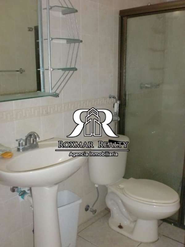 Single story house exterior covered porch driveway garden space Brisas del Golf