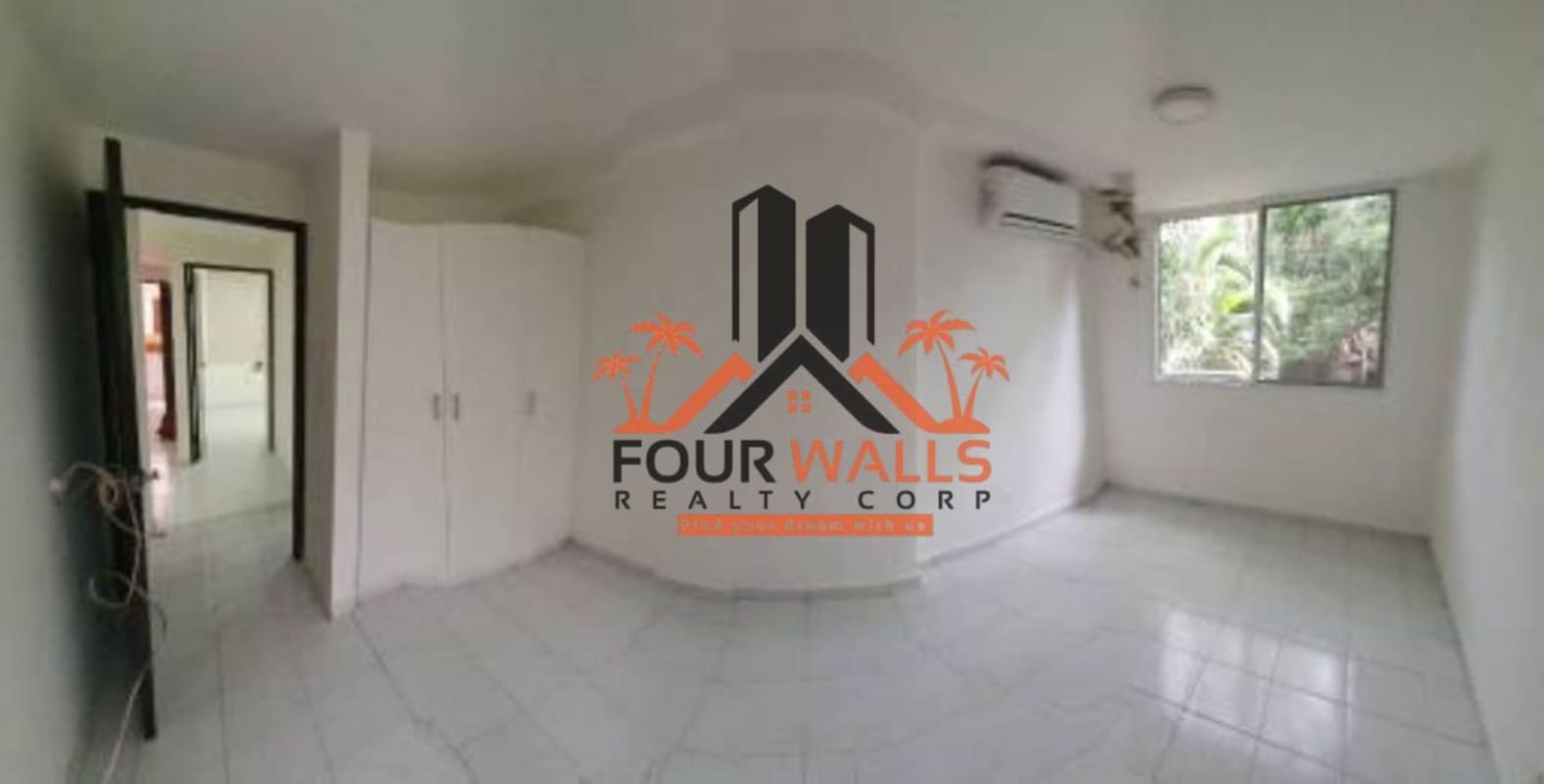 Functional kitchen with overhead cabinets, gas stove, tiled wall in PH Altos de Bella Vista Panama City