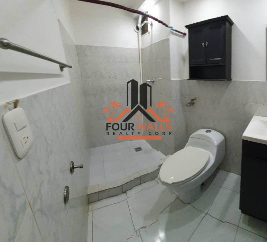 Contemporary bathroom with step-in shower and vanity at PH Altos de Bella Vista