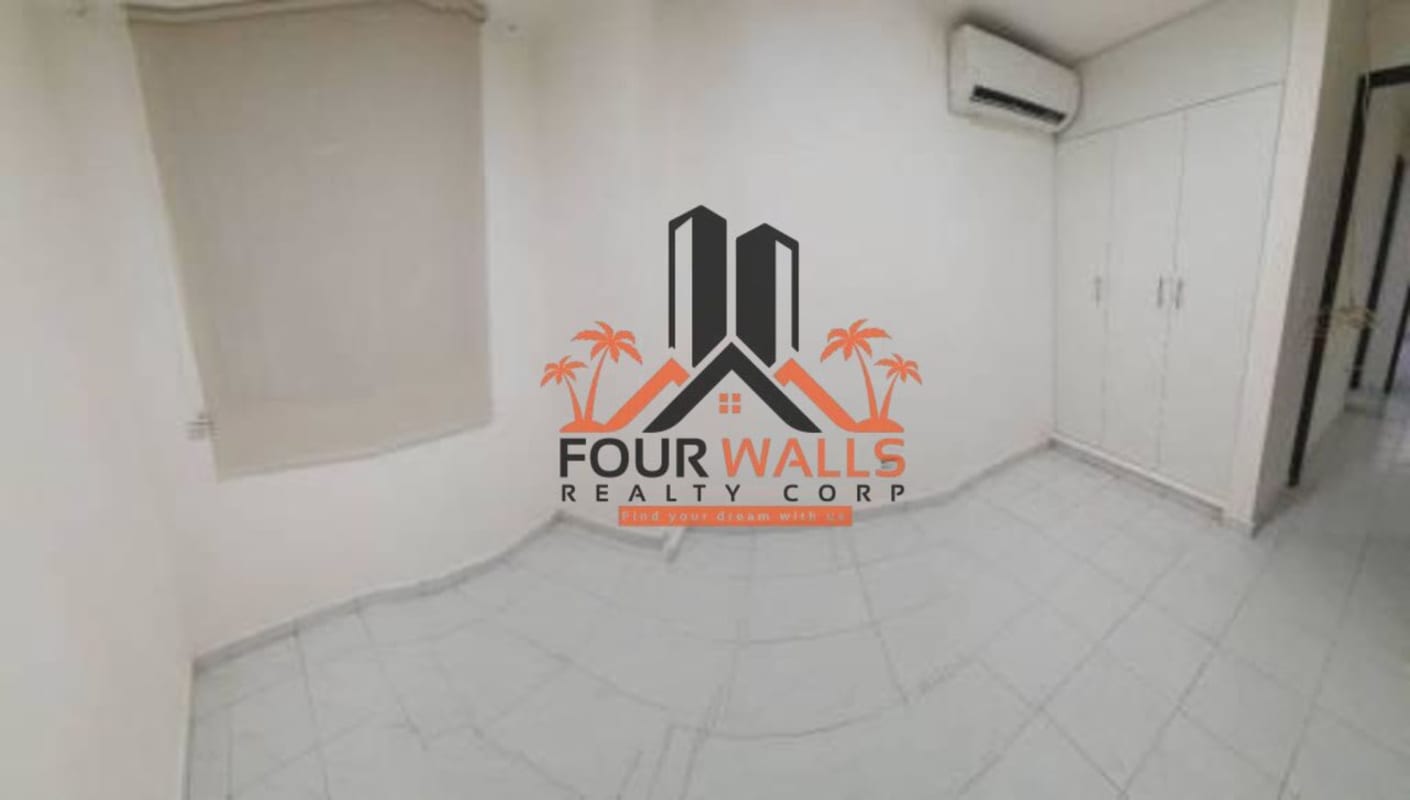 Second bedroom with built-in closet, ceramic tiles, and AC at PH Altos de Bella Vista