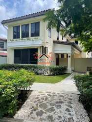 Spacious living room with large windows, vaulted ceiling, and tile floors in PH River Village