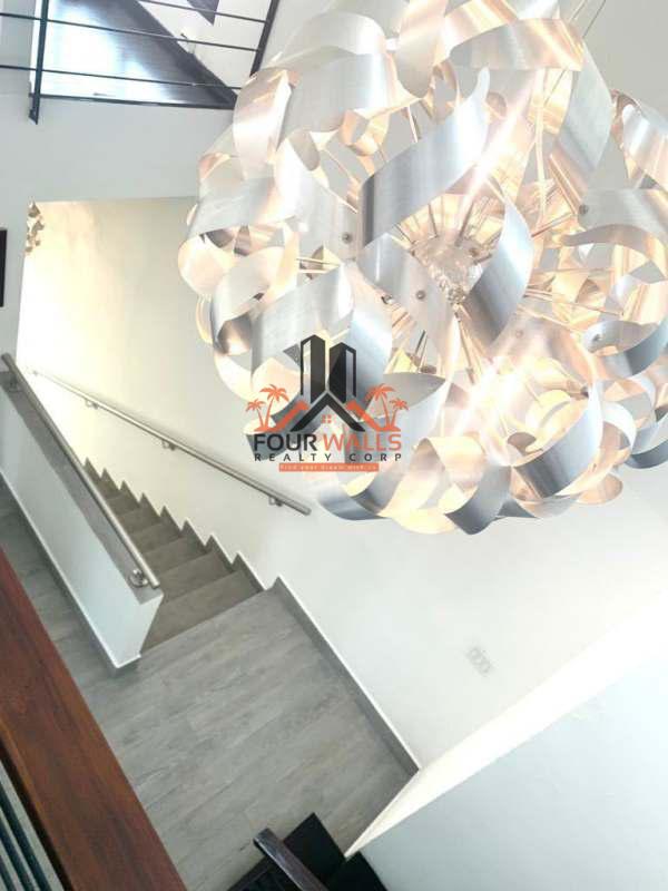 Spacious hallway with mezzanine loft metal railings PH Ultramar Plaza Panama