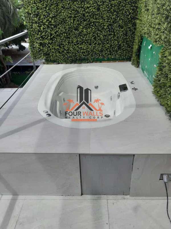 Loft hallway with large windows city views PH Ultramar Plaza Panama