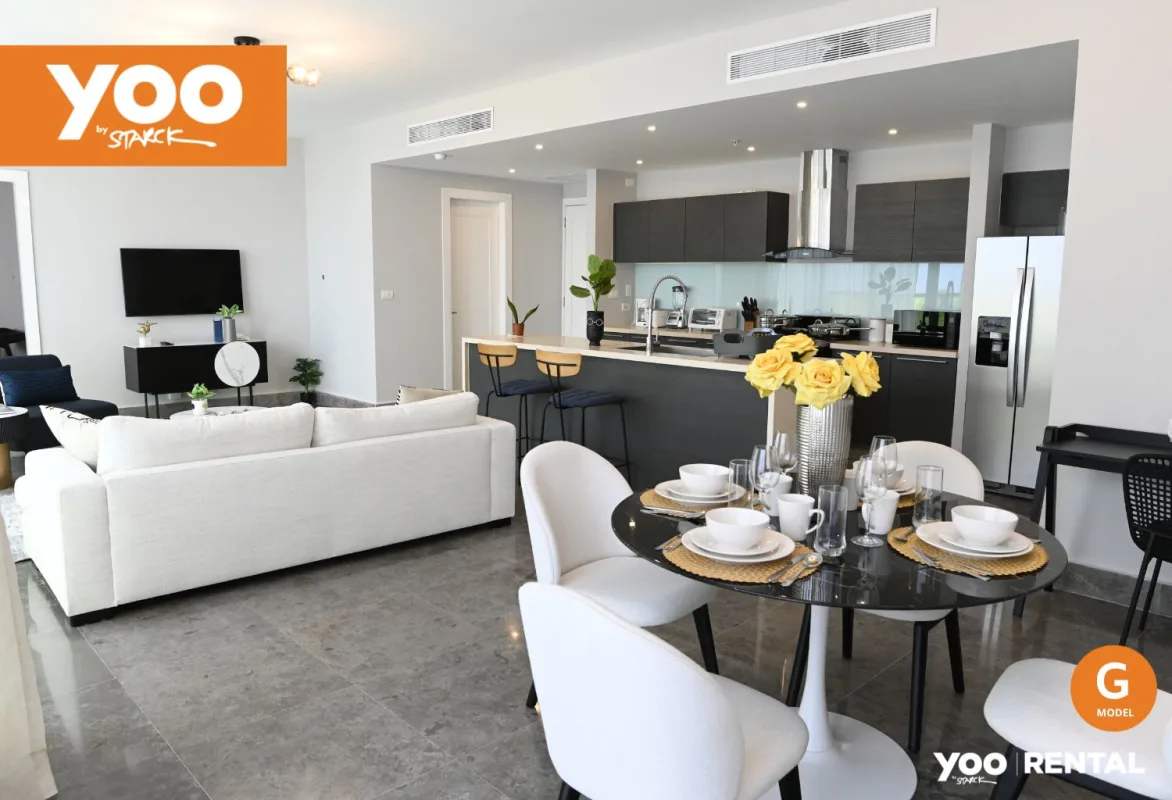 Contemporary kitchen island with marble counters in Yoo Panama apartment