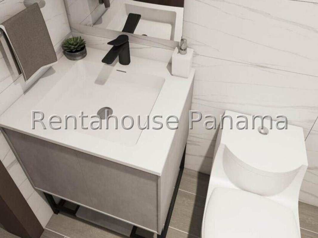 Modern bathroom with marble-style tiles and vanity in Bella Vista condo Panama