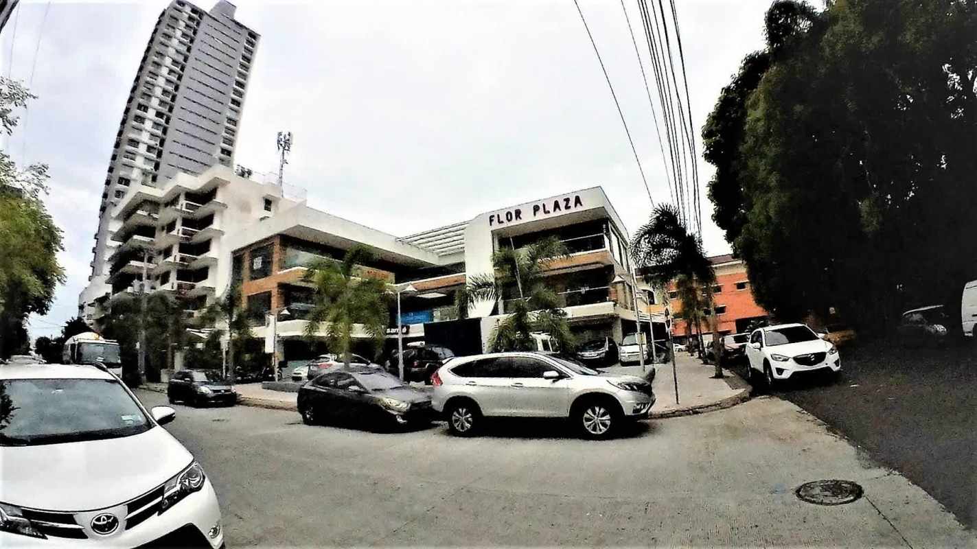 Open living and dining area with access to private balcony in Bella Vista apartment Panama City