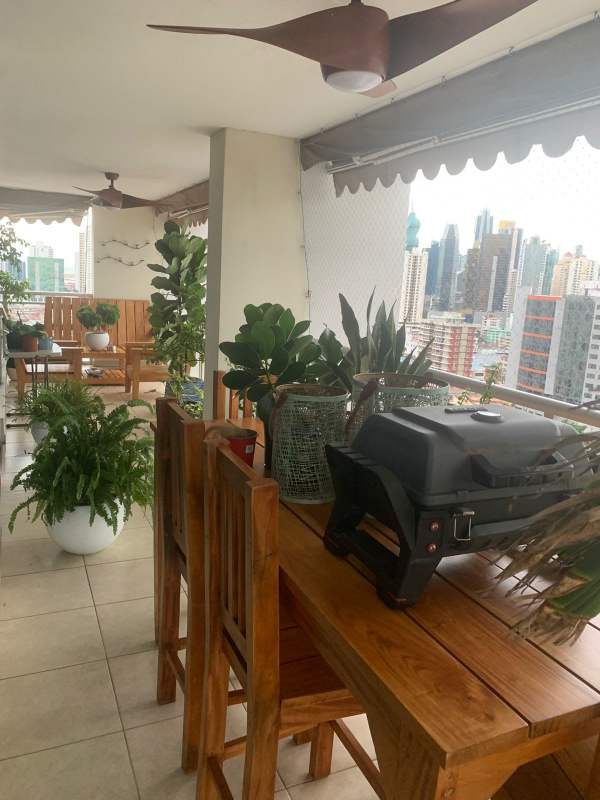 Long balcony with outdoor seating, panoramic skyline view in PH Andros Tower El Cangrejo Panama