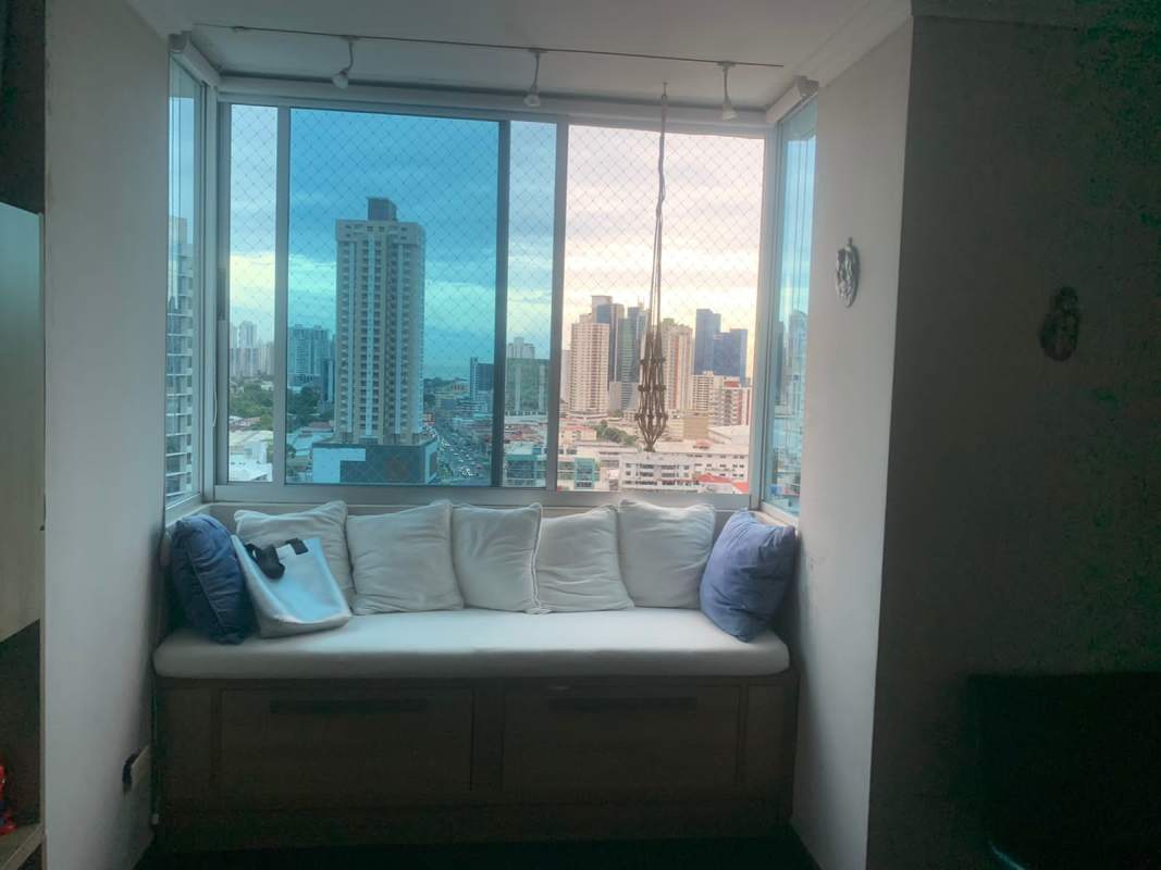 Contemporary dining space with mural wall art, modern chandelier, and city views PH Andros Tower Panama