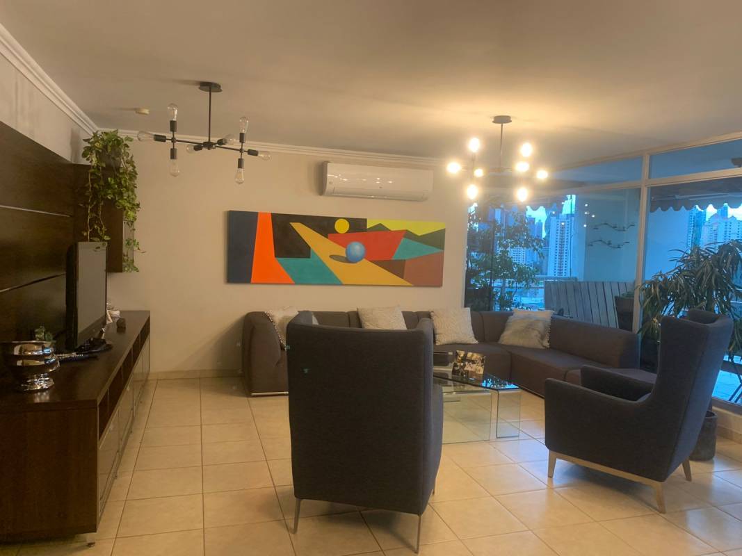 Bedroom with built-in desk, shelving, and TV PH Andros Tower El Cangrejo Panama