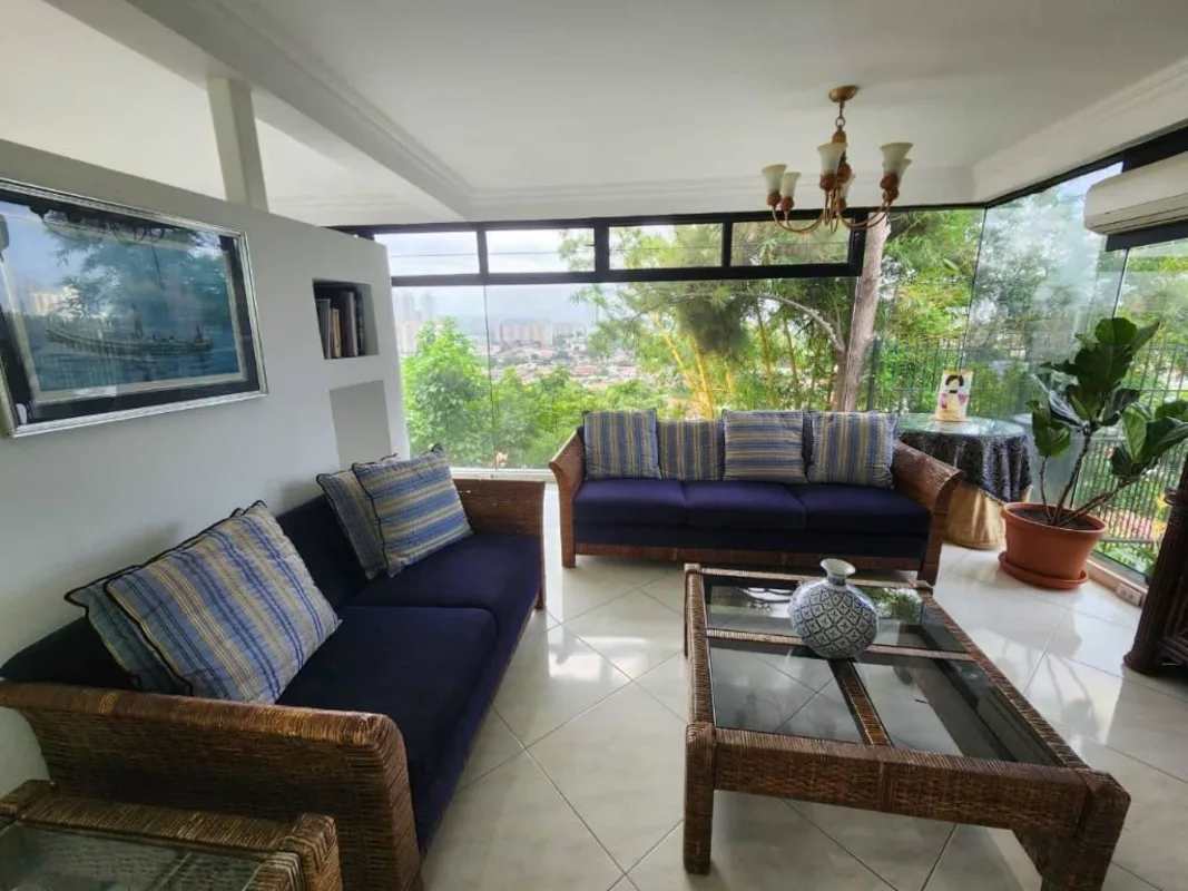 Formal dining room with large windows and city view luxury home El Ingenio Betania Panama