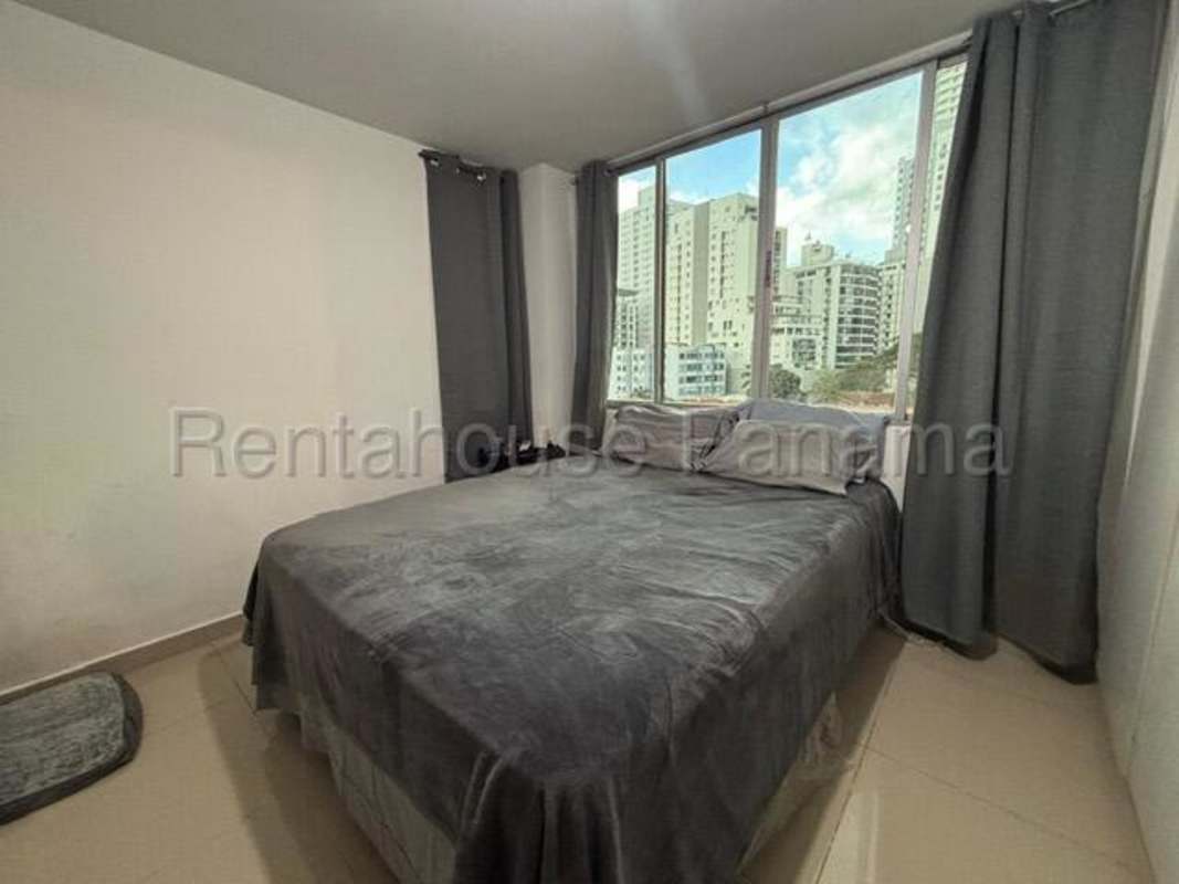 Bedroom with large window city skyline views in PH Sky Park Carrasquilla Panama City