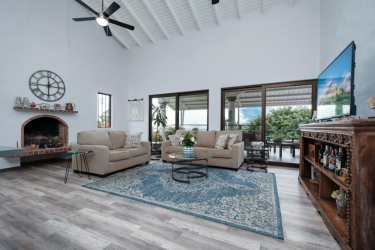 Renovated kitchen with marble backsplash and wood cabinetry in mountain home Boquete Panama
