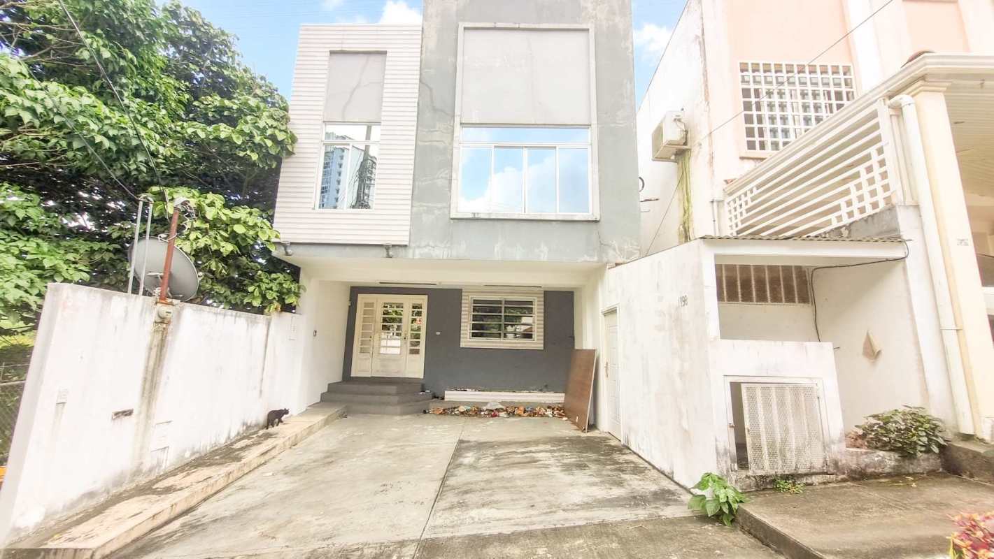 Spacious living room with large windows and tiled floor in Residencial El Limajo Panama house for sale