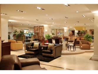 Showroom section with furniture arrangements, bright lighting commercial plaza Panama Oeste