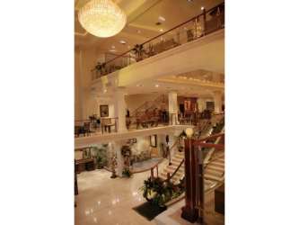 Grand foyer marble floors, spiral staircase, chandelier lighting commercial plaza Panama Oeste